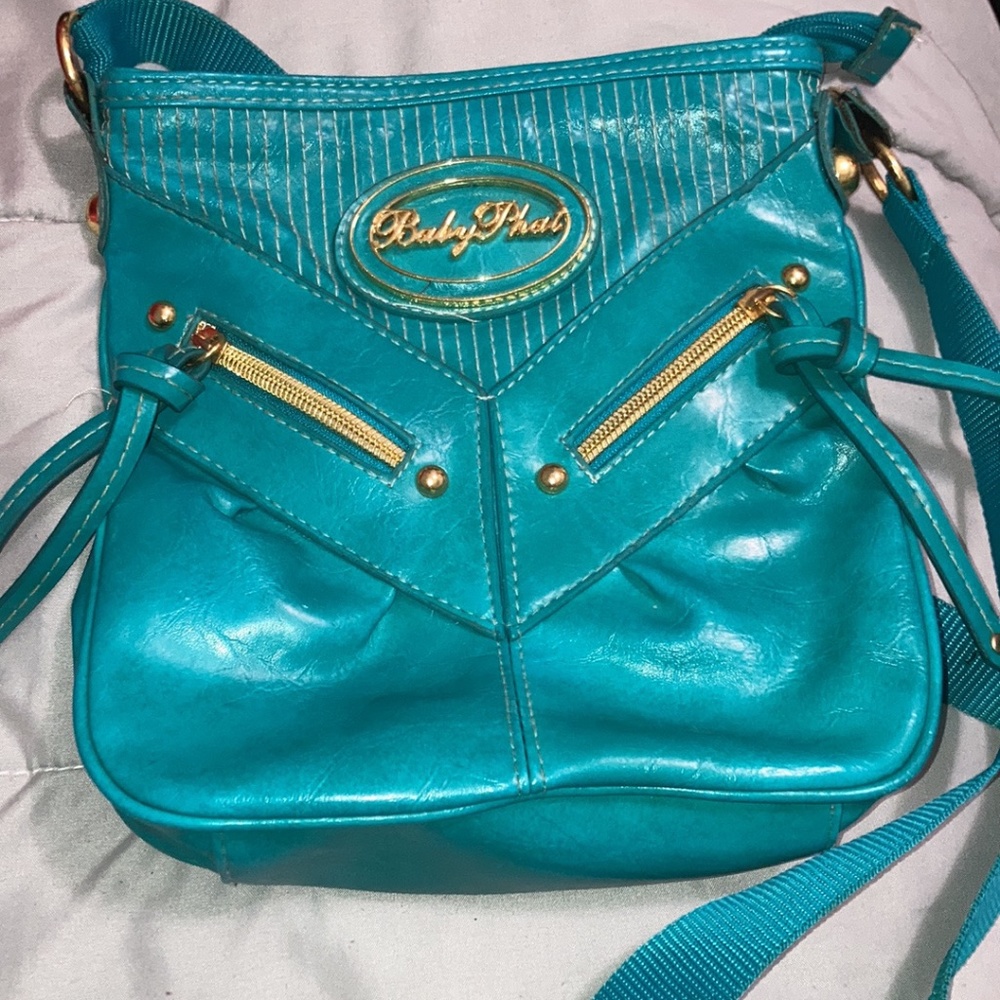 Baby Phat turquoise woman’s Crossbody Purse